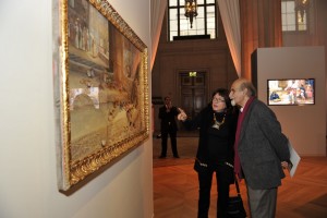 Guests discuss an artwork