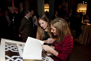 Guests reviewing the new book, Masterpieces of Oriental Art